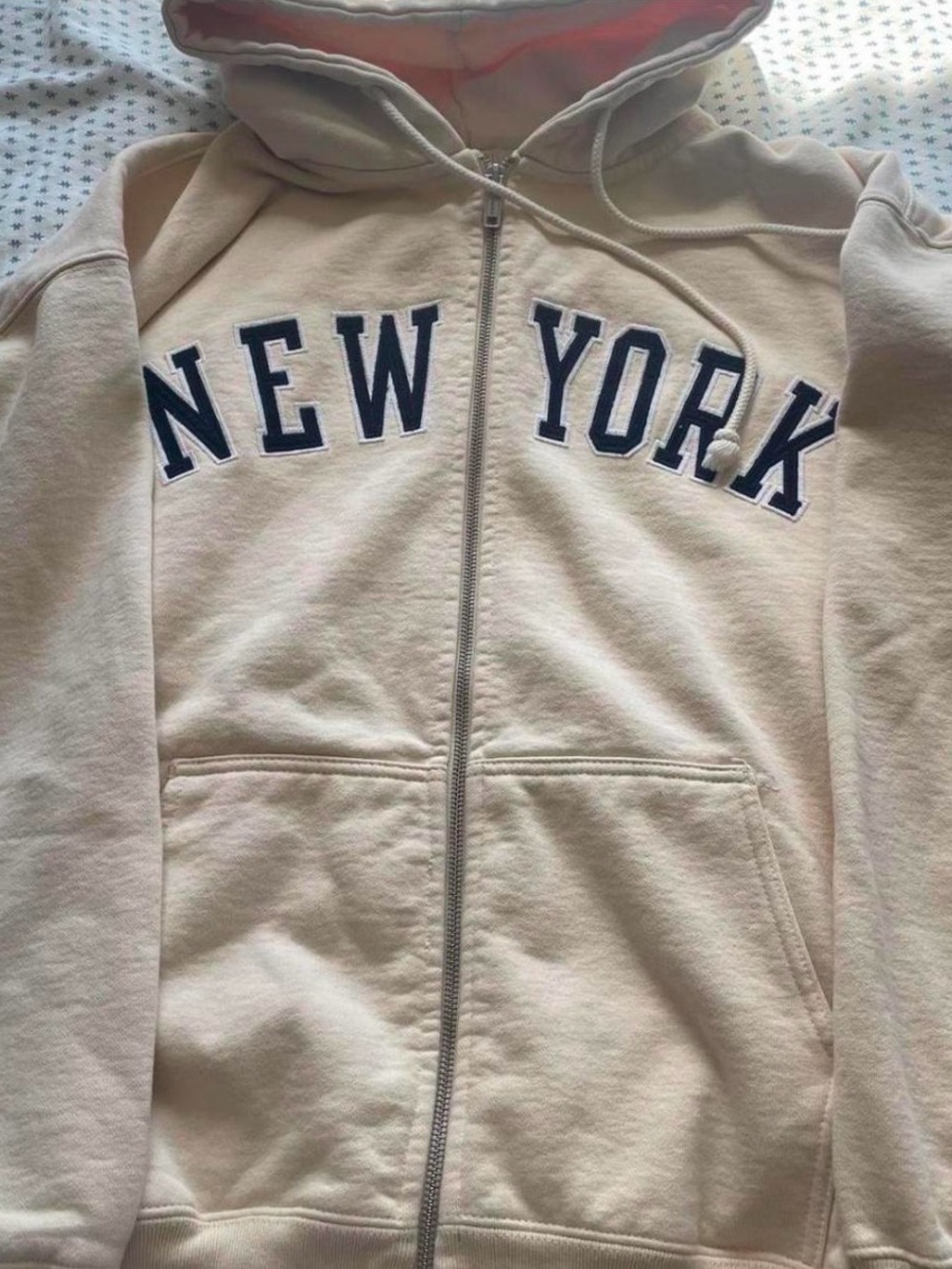 Brandy Melville Cream Zip-Up Hoodie with Navy 'NEW YORK' Lettering